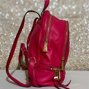 Michael Kors Rhea bag hot pink With gold hardware. Made of 100% pebbled leather